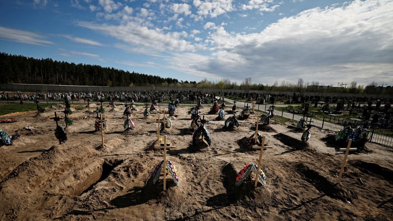 A view of new graves for people killed during Russia's invasion of Ukraine, at a cemetery in Bucha, Kyiv region, Ukraine April 28, 2022. Credit: Reuters Photo