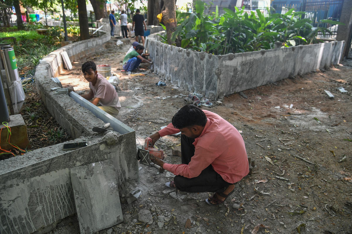 Renovation work, tails, marble fixing is going on, at Madhavan Park, Jayanagar in Bengaluru on Thursday. Credit: DH Photo