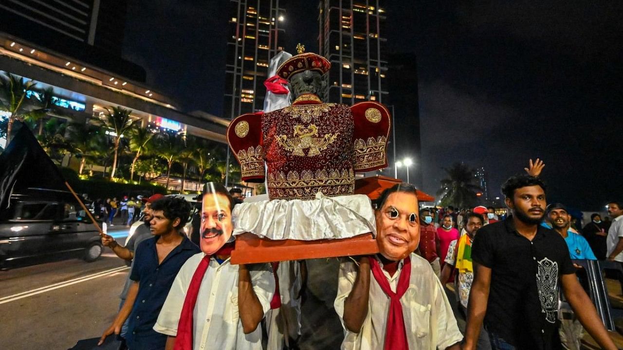 Protestors participate in an anti-government demonstration outside the President's office in Colombo. Credit: AFP Photo