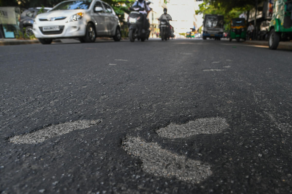 One week back asphalting road is bleached seen near Fortis hospital, Cunningham road in Bengaluru. Credit: DH Photo