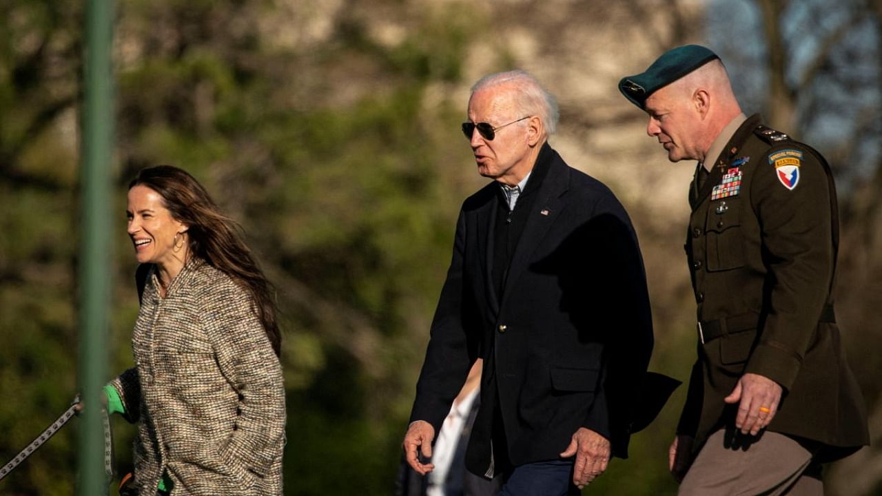 Ashley Biden, US President Joe Biden, and Col. David D. Bowling, Commander of the Joint Base Myer-Henderson Hall. Credit: Reuters Photo