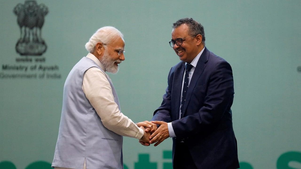 Prime Minister Narendra Modi (L) and World Health Organization Director-General Tedros Adhanom Ghebreyesus. Credit: Reuters File Photo