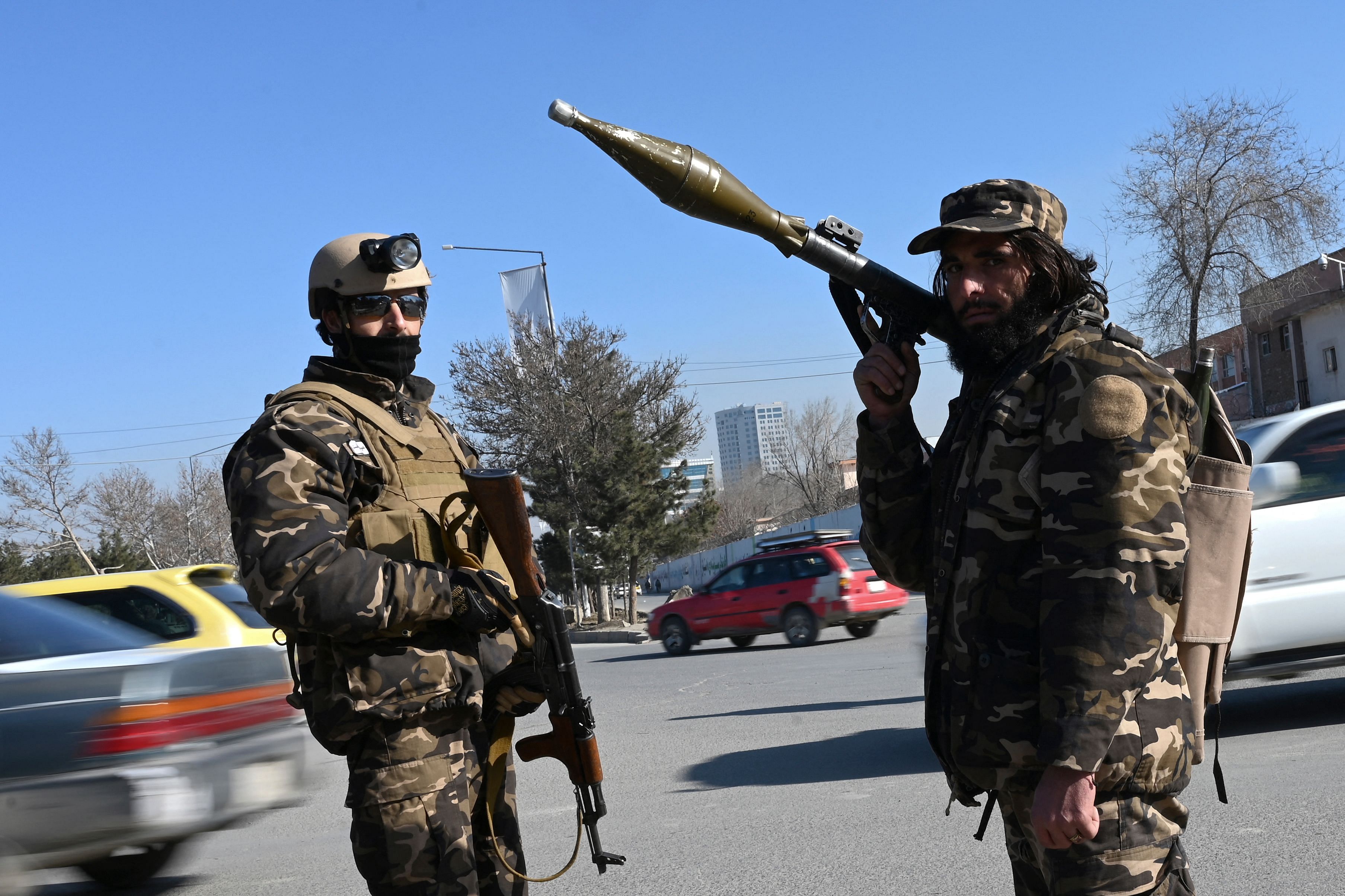 Taliban fighters stand guard before to start a women protest in support of the Taliban regime at the Ahmad Shah Massoud square in front of the US embassy in Kabul. Credit: AFP Photo
