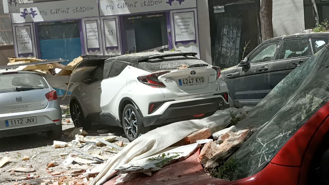 Debris and damaged vehicles are seen after a suspected gas explosion in Madrid. Credit: Victor Manuel Arellano/via Reuters 