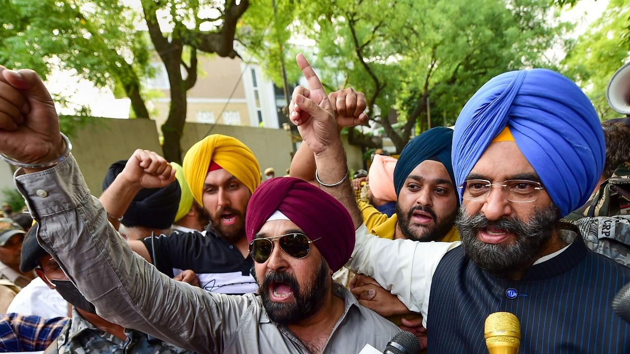 BJP leader Manjinder Singh Sirsa with party workers raise slogans during a protest against the arrest of party spokesperson Tajinder Pal Singh Bagga, outside Delhi Chief Minister Arvind Kejriwal’s residence, in New Delhi. Credit: PTI Photo