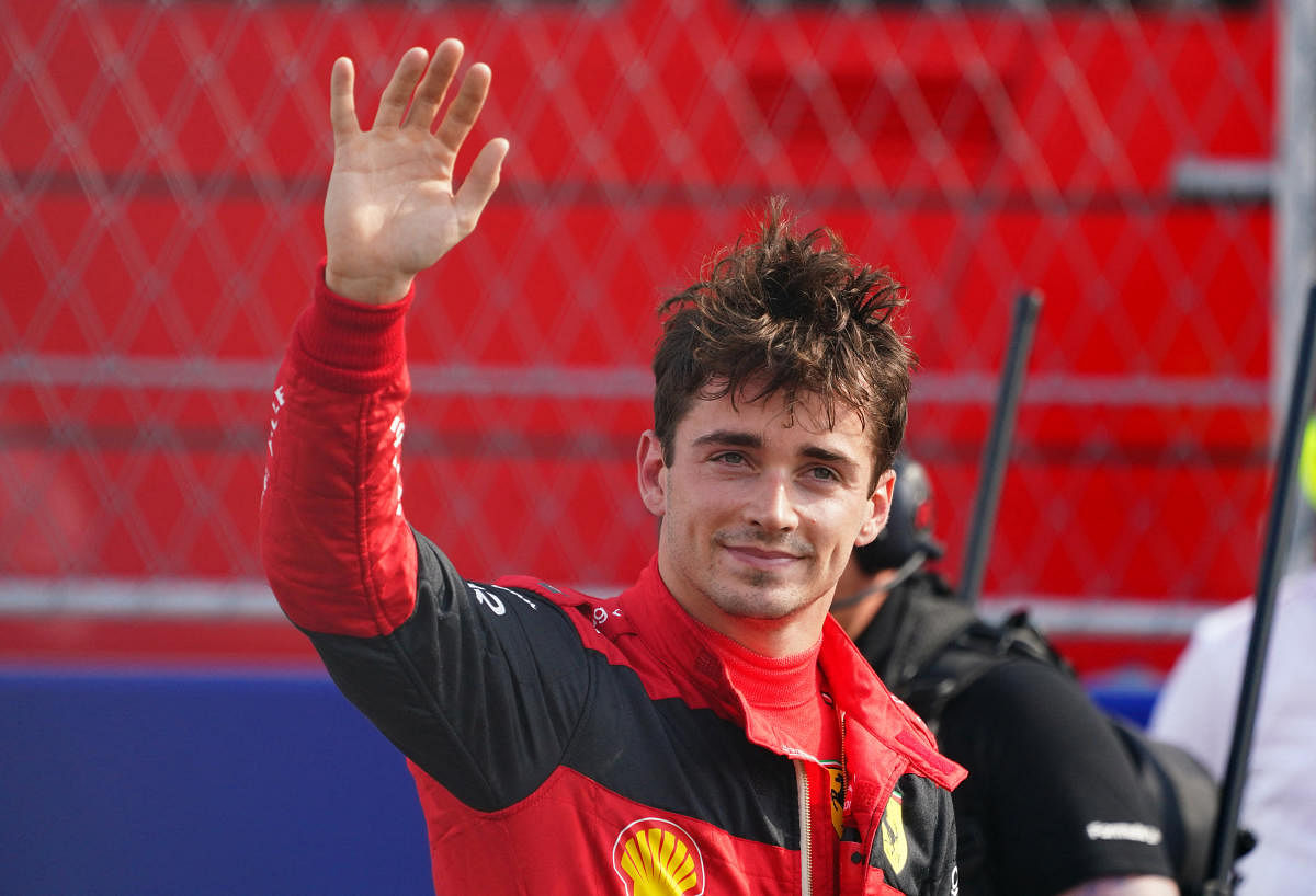 Ferrari driver Charles Leclerc of Monaco waves to the fans in the stands after winning the pole position following qualifying for the Miami Grand Prix. Credit: USA Today Sports