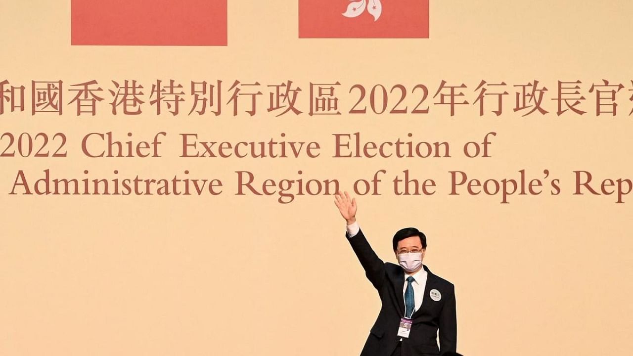 John Lee waves after becoming the city's new chief executive in Hong Kong on May 8, 2022. Credit: AFP Photo