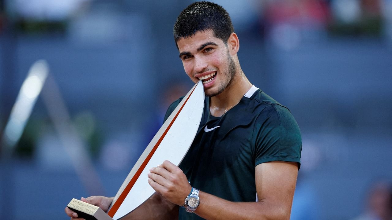 Spain's Carlos Alcaraz Garfia celebrates with the trophy after winning the final against Germany's Alexander Zverev. Credit: Reuters Photo