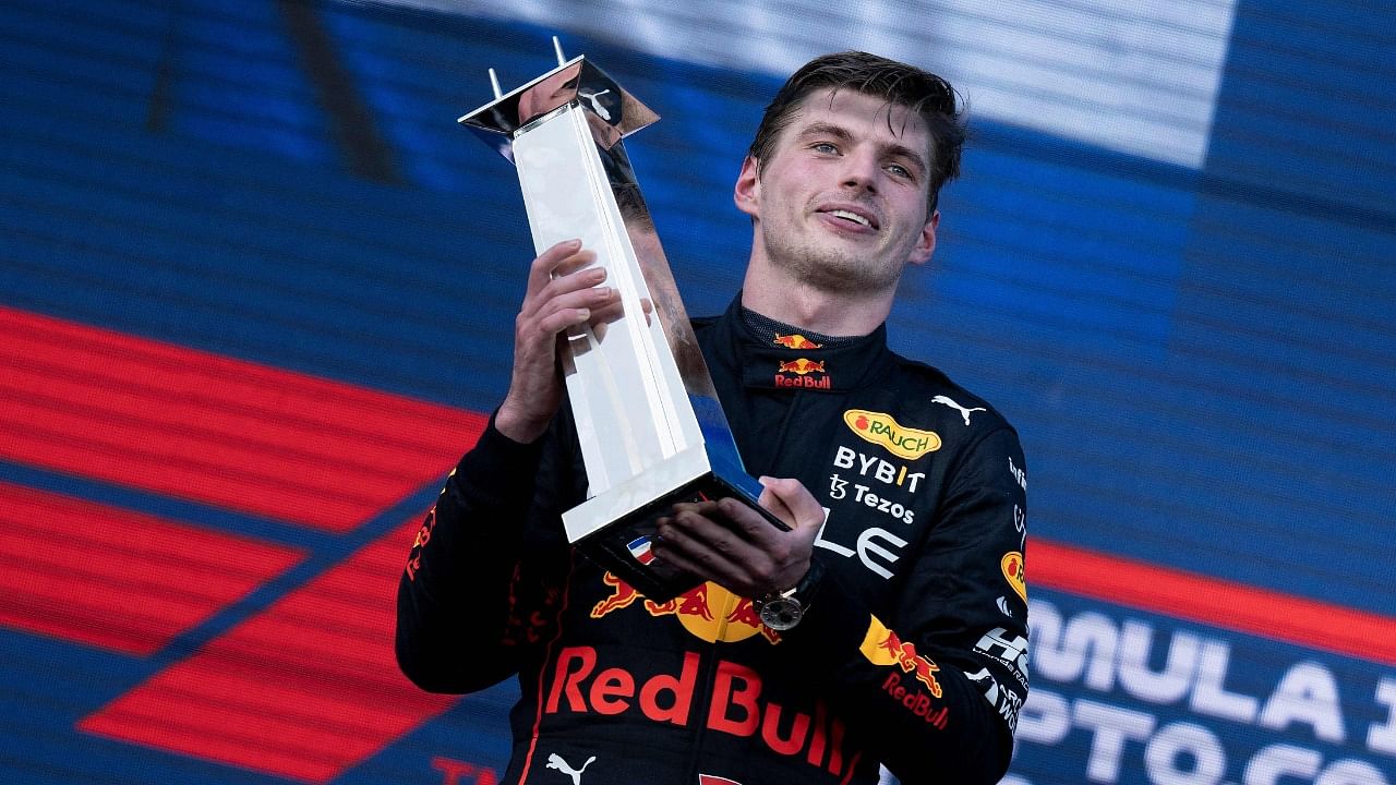 Red Bull Racing's Dutch driver Max Verstappen celebrates on the podium after winning the Miami Formula One Grand Prix at the Miami International Autodrome. Credit: AFP Photo
