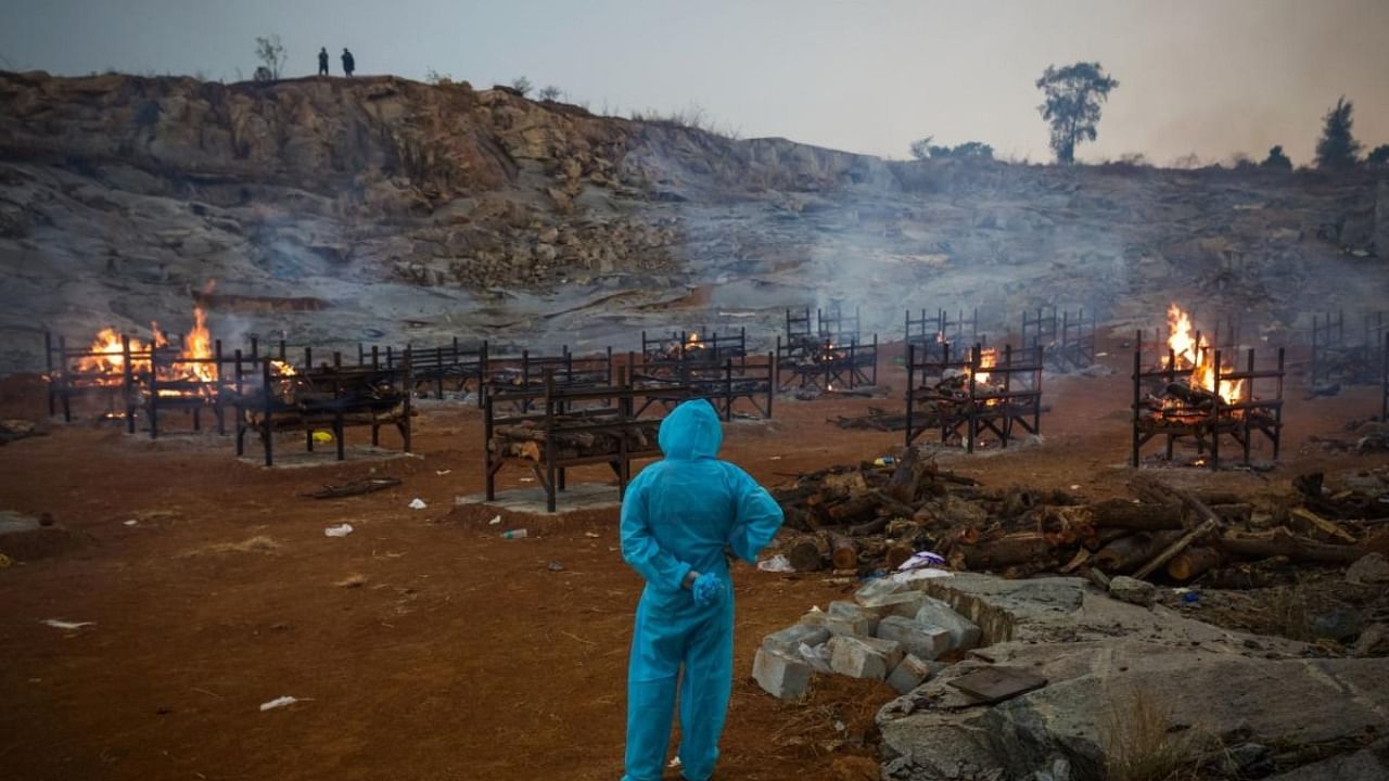 Mass cremations in a granite quarry in Bangalore on April 30. Credit: Bloomberg