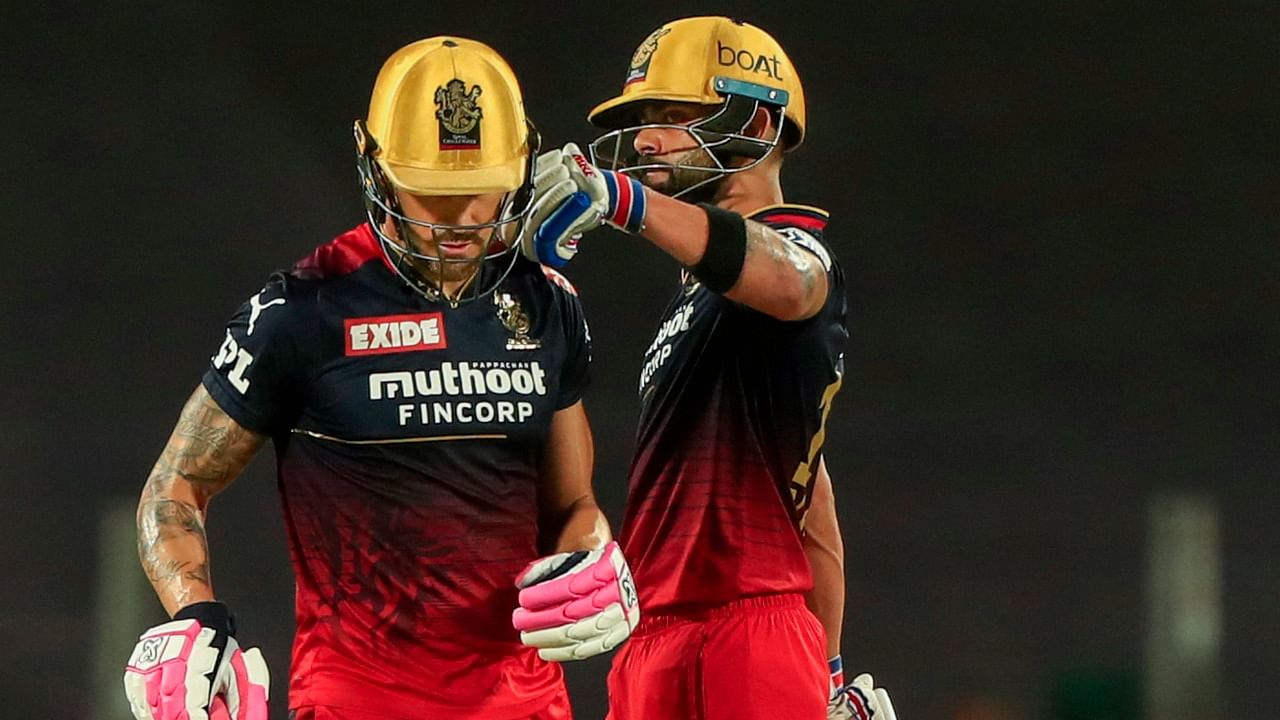 Virat Kohli of Royal Challengers Bangalore with his captain Faf du Plessis during the 49th T20 cricket match of the Indian Premier League 2022. Credit: PTI Photo
