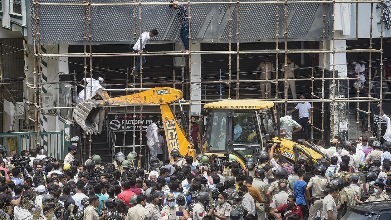 Locals stage a protest during an anti-encroachment drive by Municipal Corporation of Delhi (MCD), at Shaheen Bagh area in New Delhi, Monday, May 9, 2022. Credit: PTI Photo