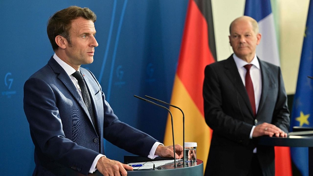 German Chancellor Olaf Scholz (R) and French President Emmanuel Macron address a press conference at the Chancellery in Berlin. Credit: AFP Photo