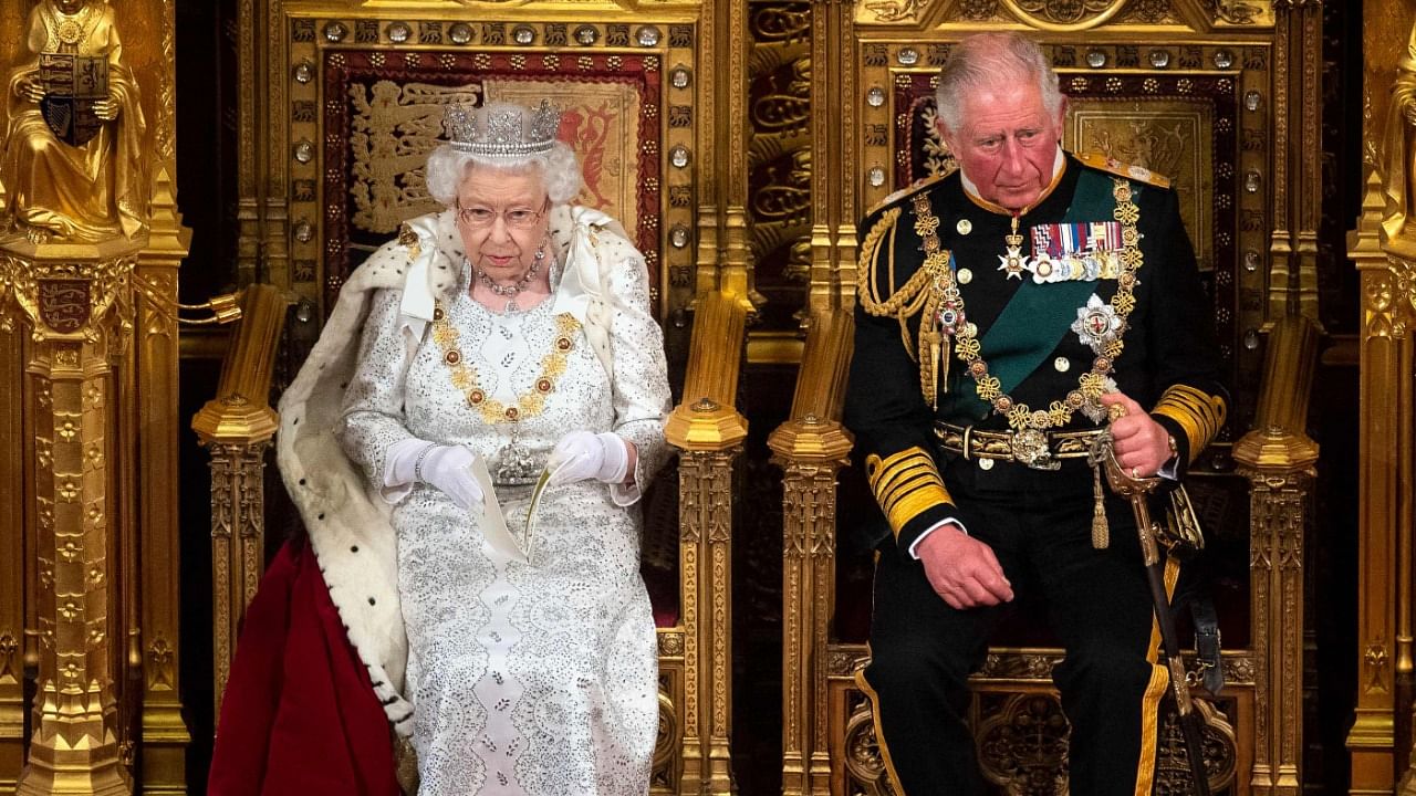 Britain's Queen Elizabeth II (L) sits with Britain's Prince Charles, Prince of Wales. Credit: AFP Photo