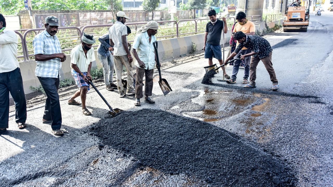While a few stretches have been neatly asphalted with bituminous concrete, most roads bear temporary patchwork that proves to be tricky for two-wheeler riders. Credit: DH File Photo