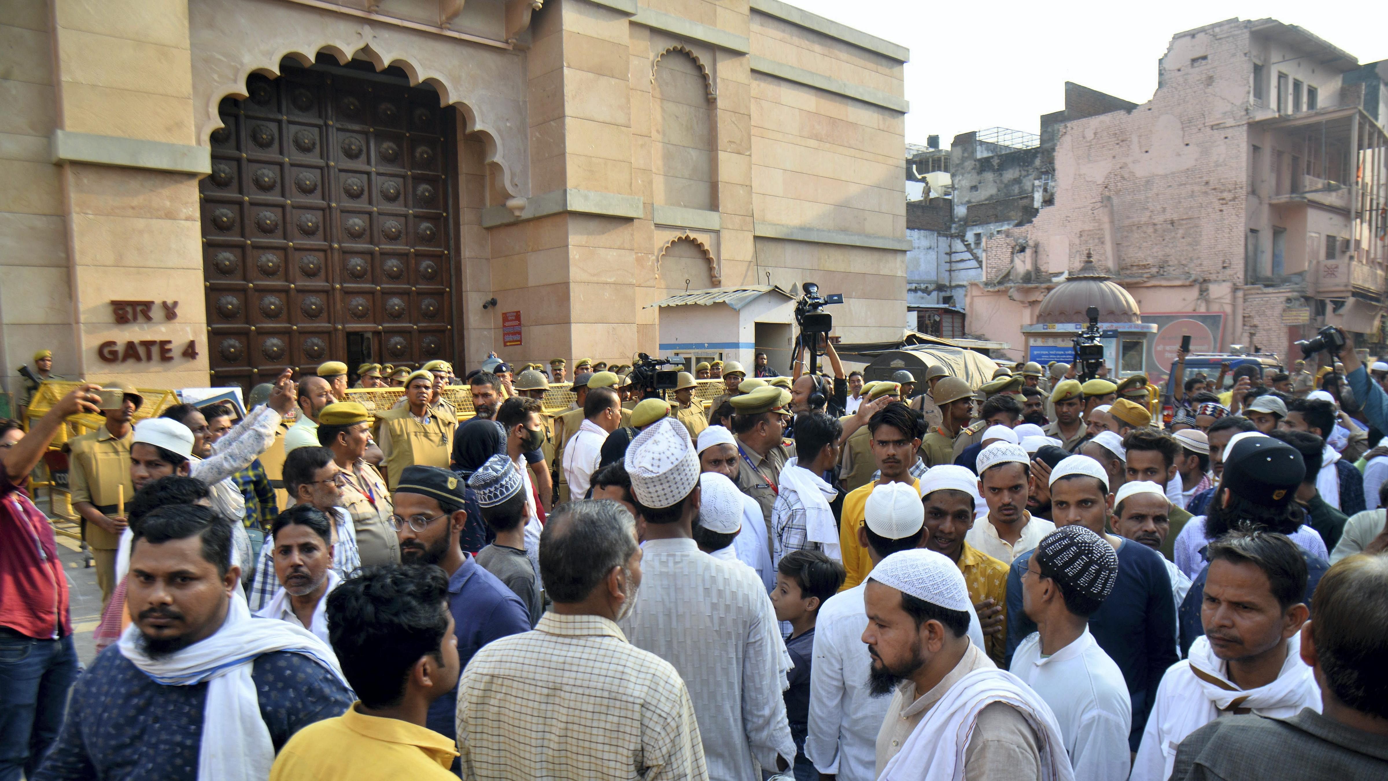 Members of the Muslim community gather at the site during the survey of the Gyanvapi Masjid complex. Credit: PTI File Photo