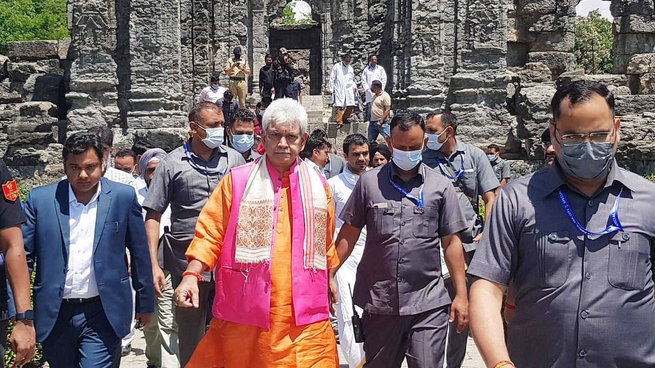 Lieutenant Governor Manoj Sinha during his visit to the ancient Martand Sun temple to participate in auspicious 'Navgrah Ashtamangalam Pooja', in Anantnag. Credit: PTI Photo