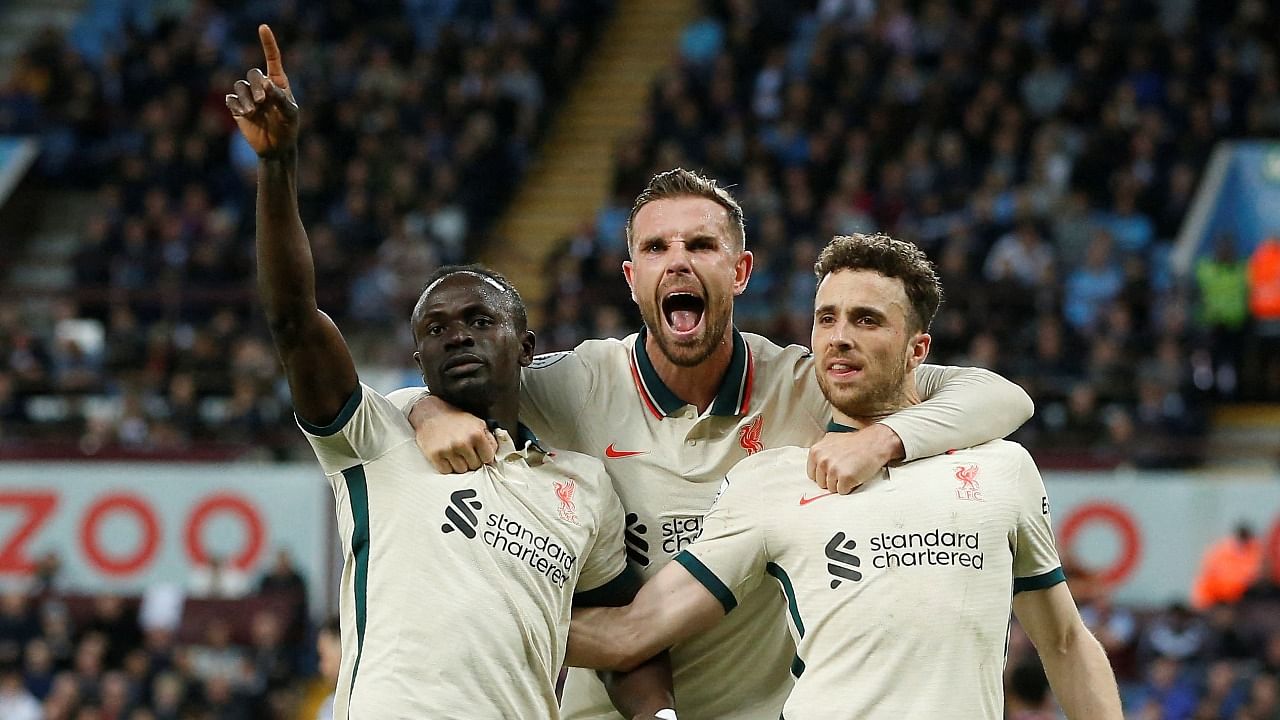 Liverpool's Sadio Mane celebrates scoring their second goal with Diogo Jota and Jordan Henderson. Credit: Reuters Photo