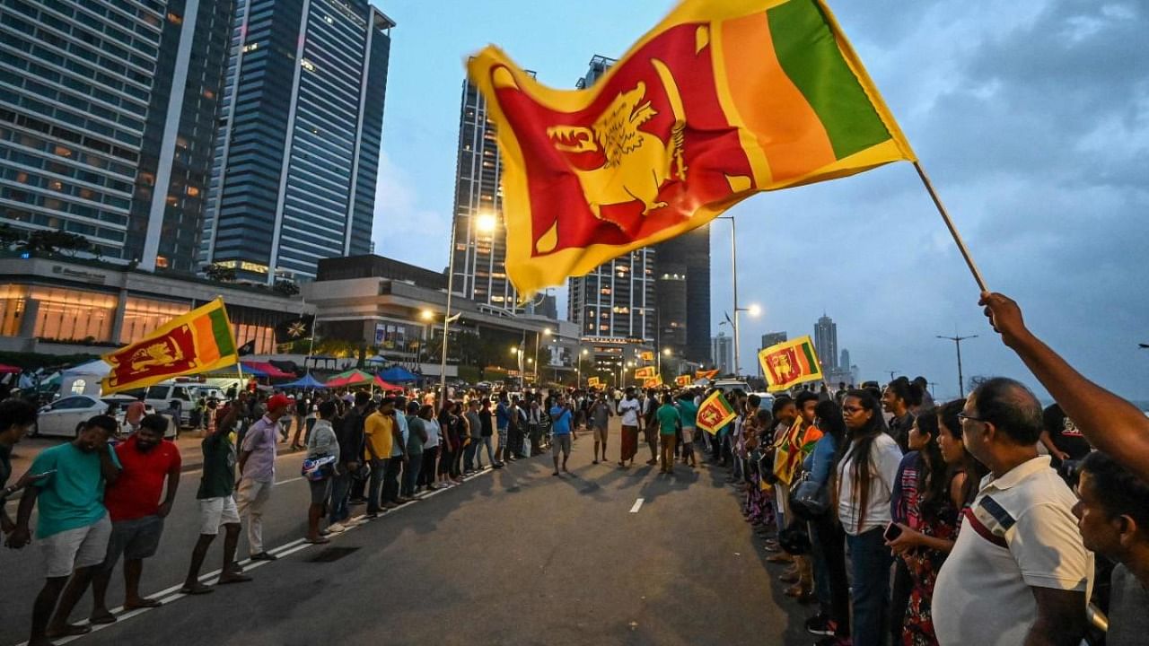 Anti-government demonstrators take part in a protest near the President's office in Colombo. Credit: Reuters Photo
