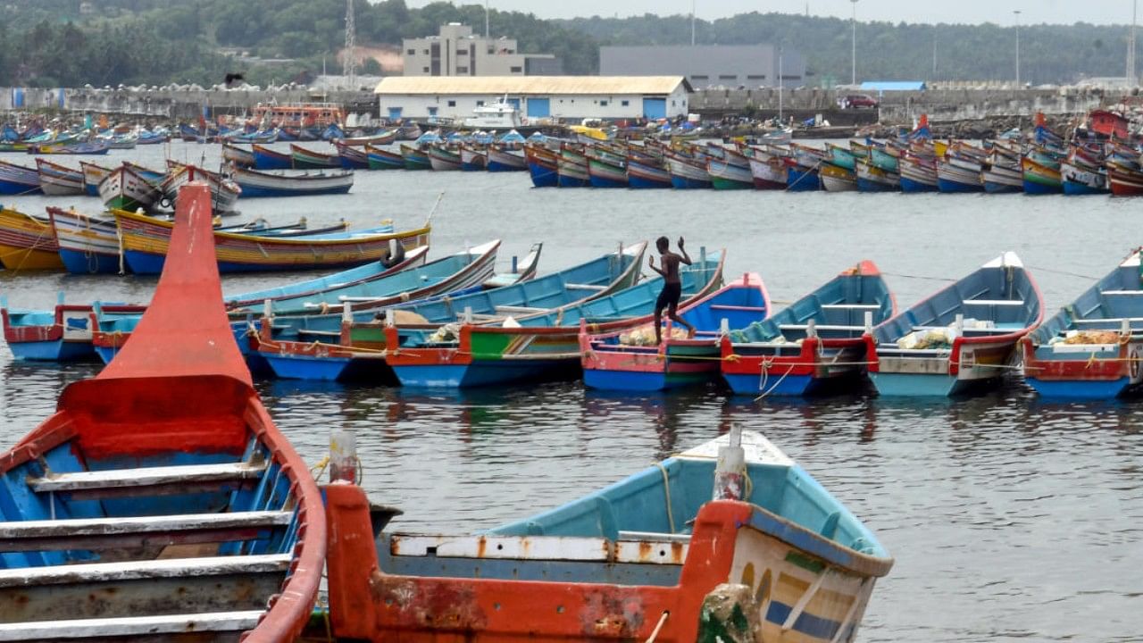 Boats parked on the shore by fishermen as part of precautionary measures for Cyclone Asani, at Vizhinjam port in Thiruvananthapuram. Credit: PTI Photo