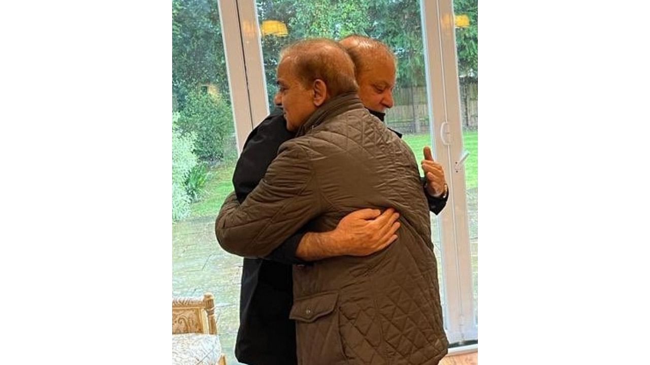 Pakistan Prime Minister Shehbaz Sharif (L) and elder brother Nawaz hug during their meeting at his London home. Credit: IANS Photo