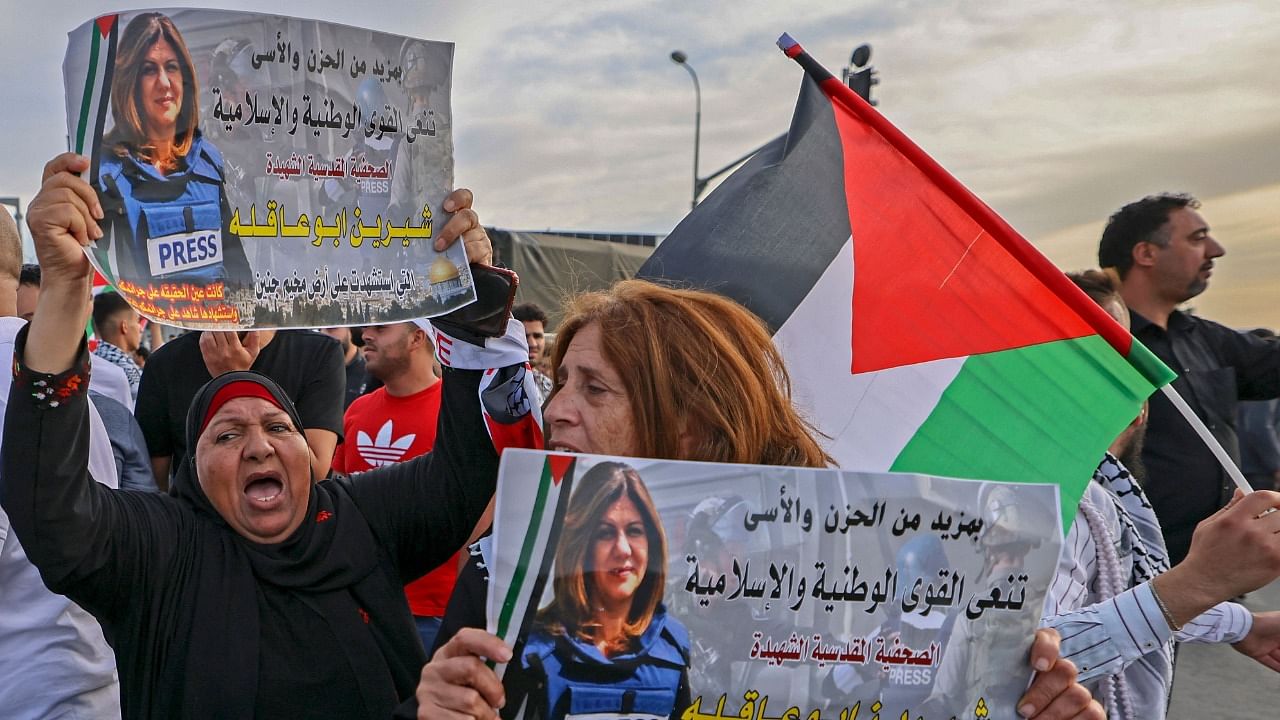 Palestinians protest the death of veteran Al-Jazeera journalist Shireen Abu Akleh, who was shot dead while covering an Israeli army raid in Jenin. Credit: AFP Photo