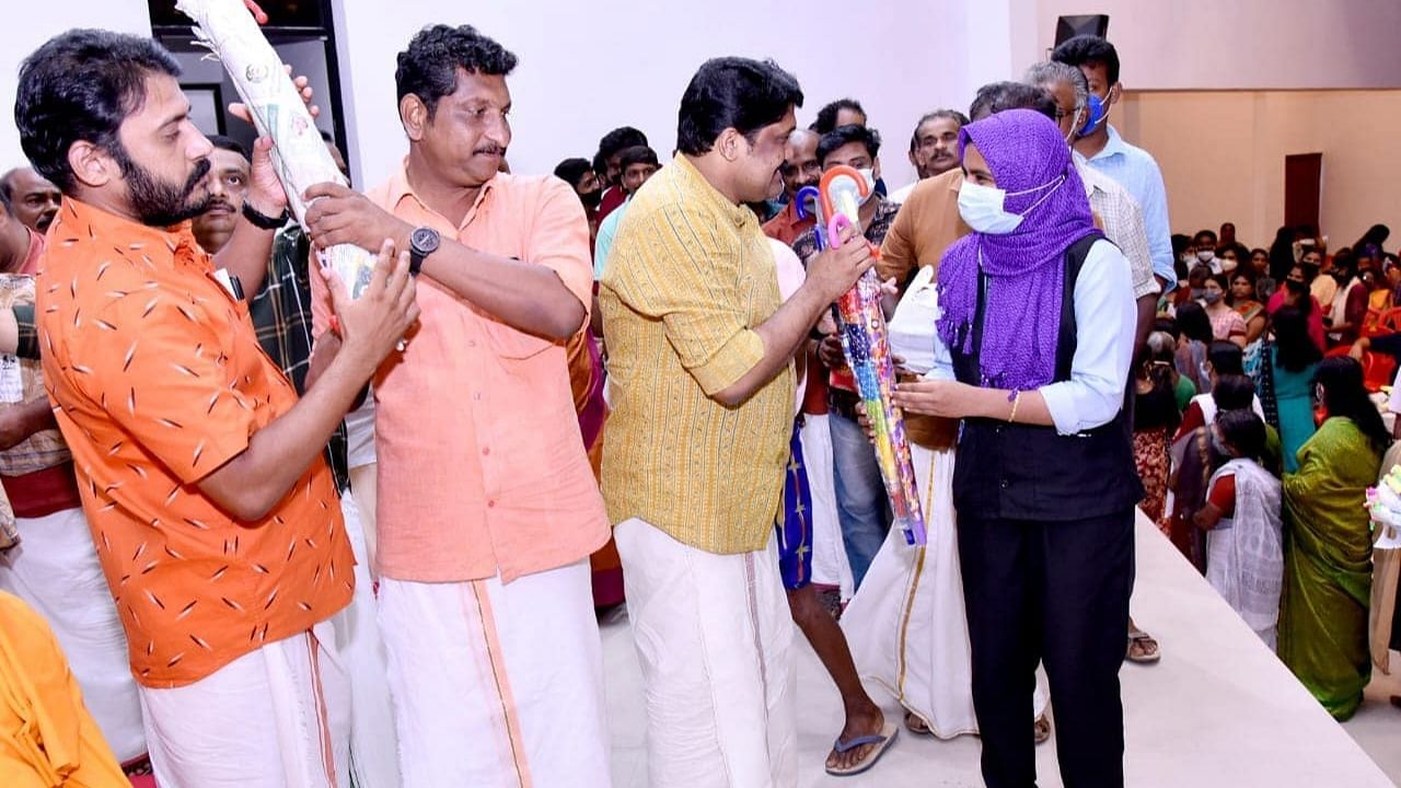 CPM's Rajya Sabha MP from Kerala A A Rahim being presented with umbrellas during a reception in Thiruvananthapuram. Credit: Special arrangement