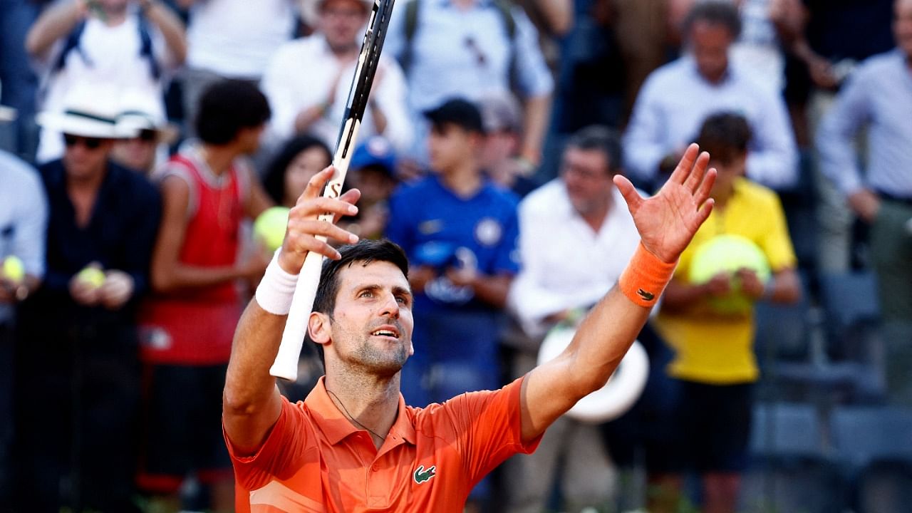 Novak Djokovic celebrates winning his third round match against Switzerland's Stanislas Wawrinka. Credit: Reuters Photo