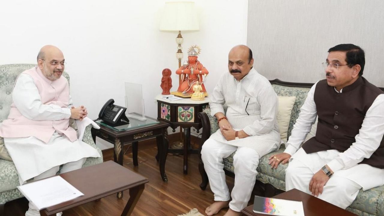 The CM met Union Home Minister Amit Shah here for more than half an hour. Union Parliamentary Affairs Minister Pralhad Joshi was also present at the meeting. Credit: DH Photo