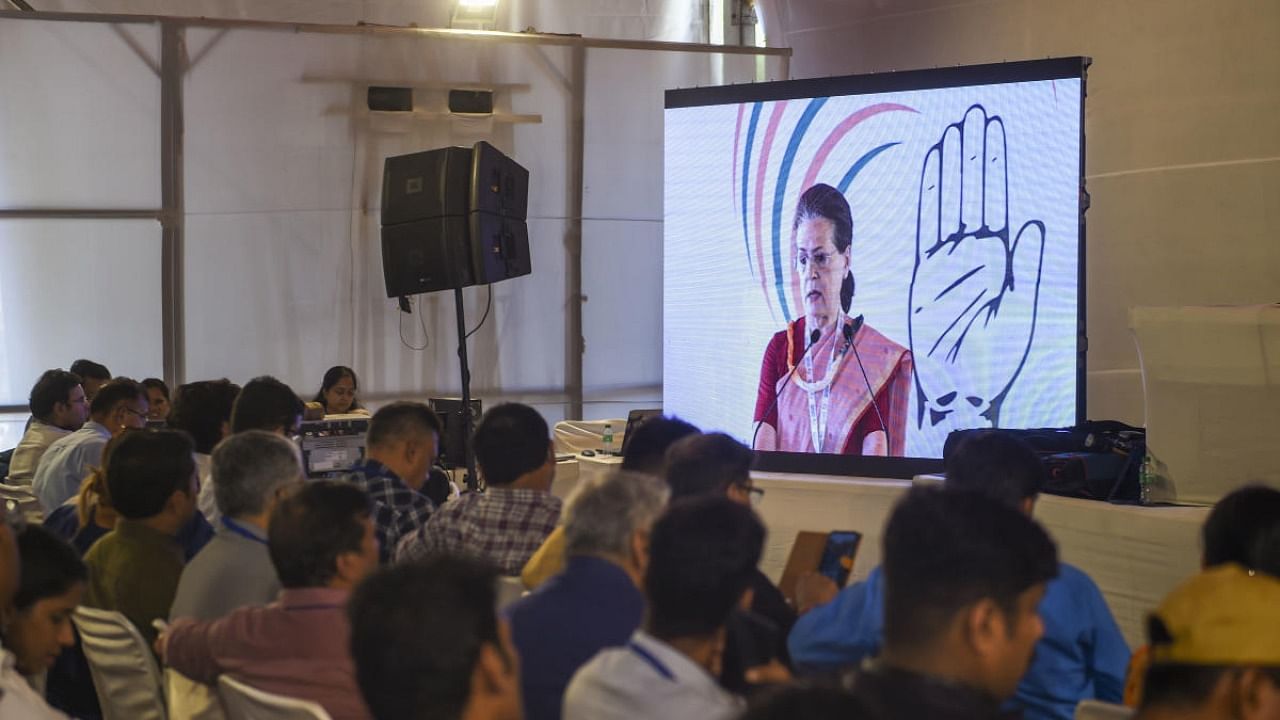 Media personnel listen to the virtual address of Congress interim President Sonia Gandhi during the party's 'Nav Sankalp Chintan Shivir', in Udaipur. Credit: PTI photo