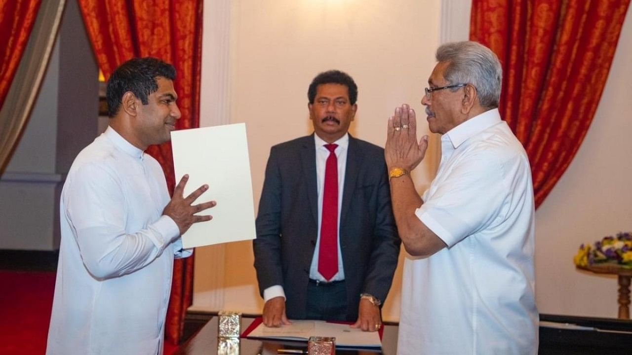 President Gotabaya Rajapaksa, right, greets Kanchana Wijesekera after the latter took oath of office as the Power and Energy Minister in Colombo, Sri Lanka. Credit: AP Photo