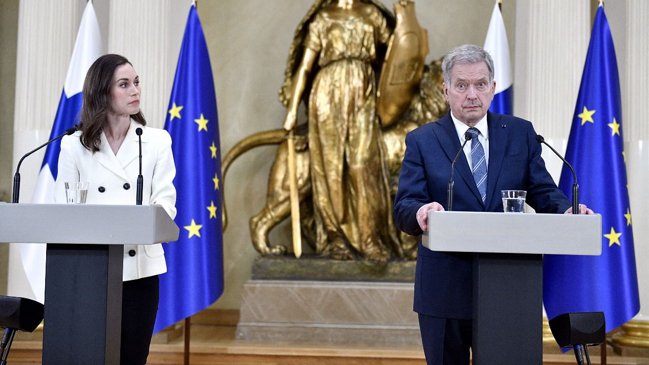 Finland's Prime Minister Sanna Marin (L) with Finland's President Sauli Niinisto. Credit: Reuters Photo