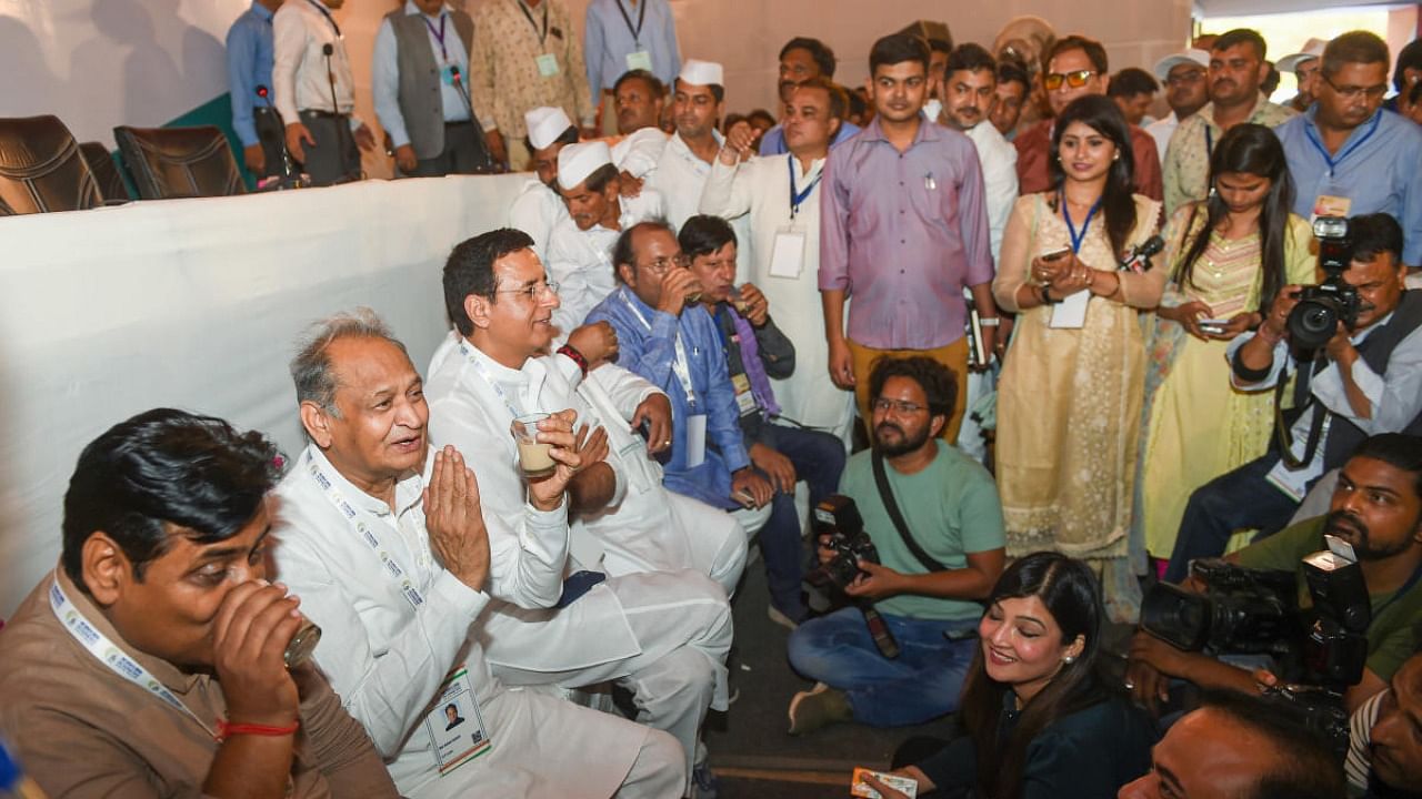 Rajasthan Chief Minister and Congress leader Ashok Gehlot with party leaders Randeep Sujrewala and Govind Singh Dotasra during the party's 'Nav Sankalp Shivir',at Media Centre in Udaipur. Credit: PTI Photo