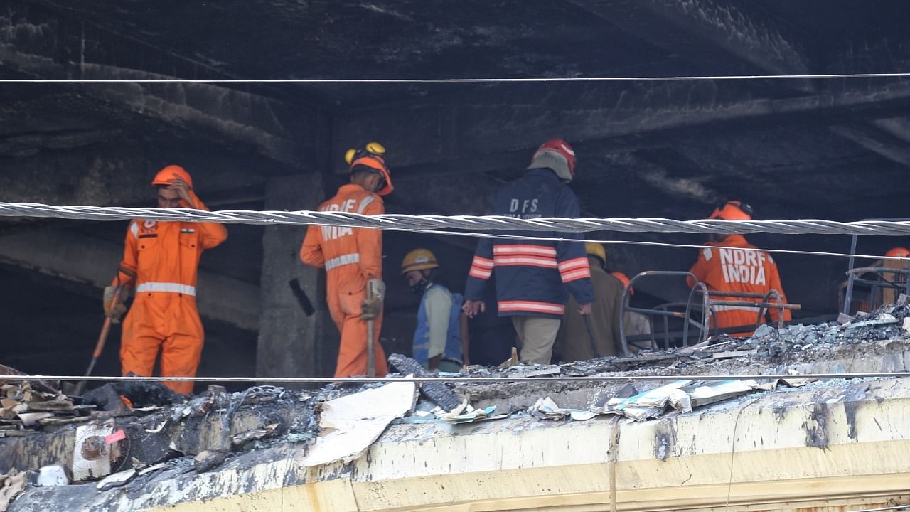 NDRF team at the site of a fire in a four-storey commercial building at Mundka area in New Delhi. Credit: IANS Photo