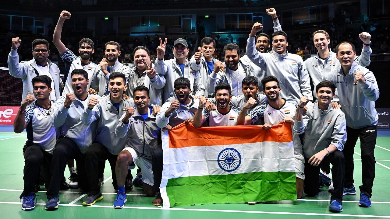 Members of the Indian men's badminton team celebrate on the podium after defeating Indonesia in the men's finals of the Thomas and Uber Cup badminton tournament in Bangkok. Credit: AFP Photo