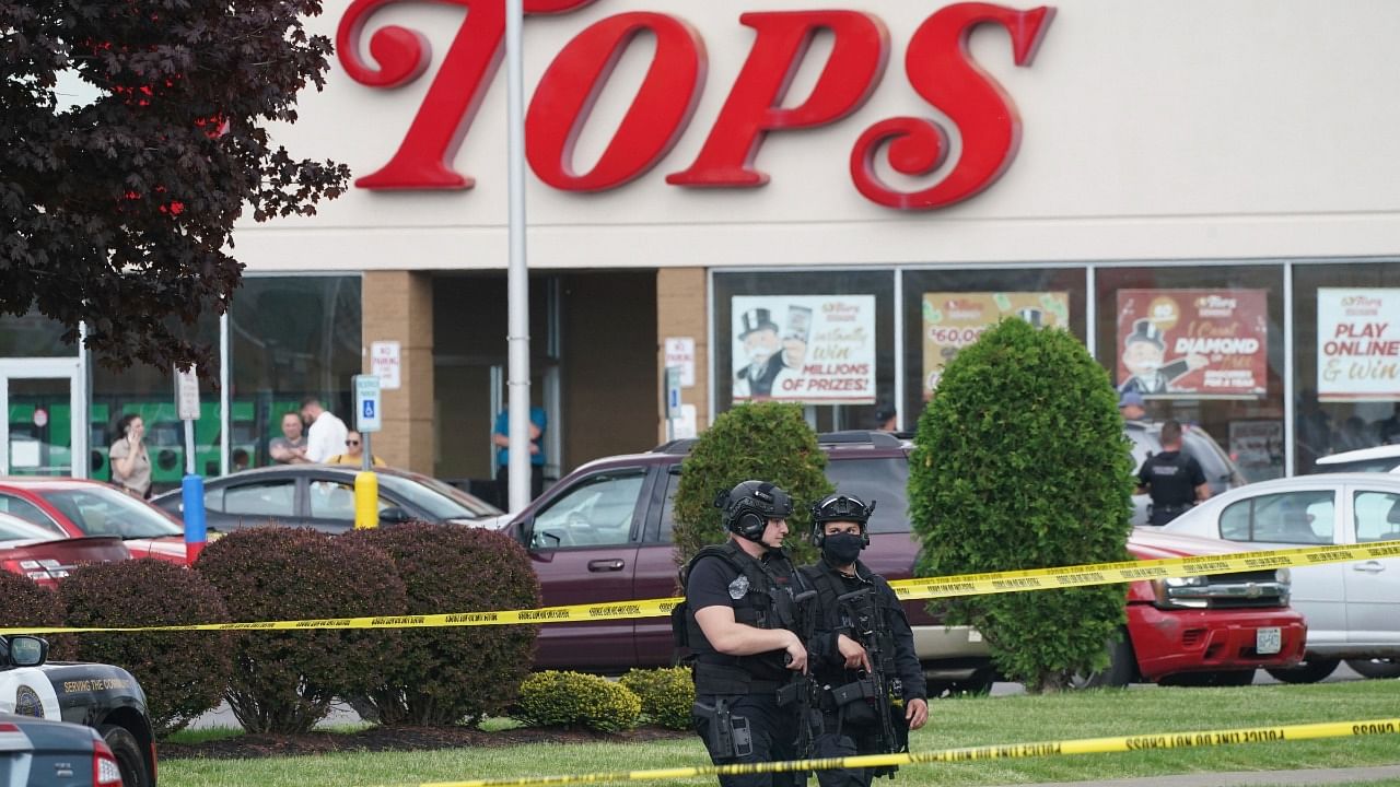 Police secure an area around a supermarket where several people were killed in a shooting, Saturday, May 14, 2022 in Buffalo. Credit: AP Photo