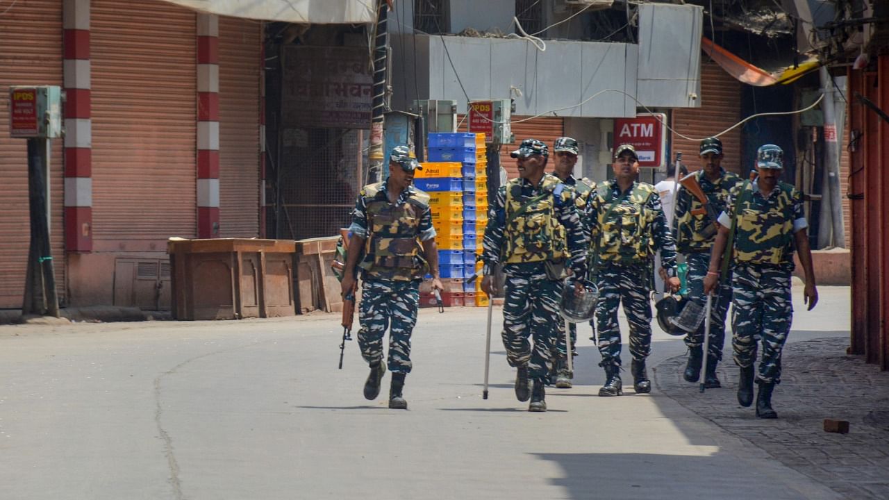 Security personnel patrol during a videographic survey at Gyanvapi Masjid complex. Credit: PTI Photo