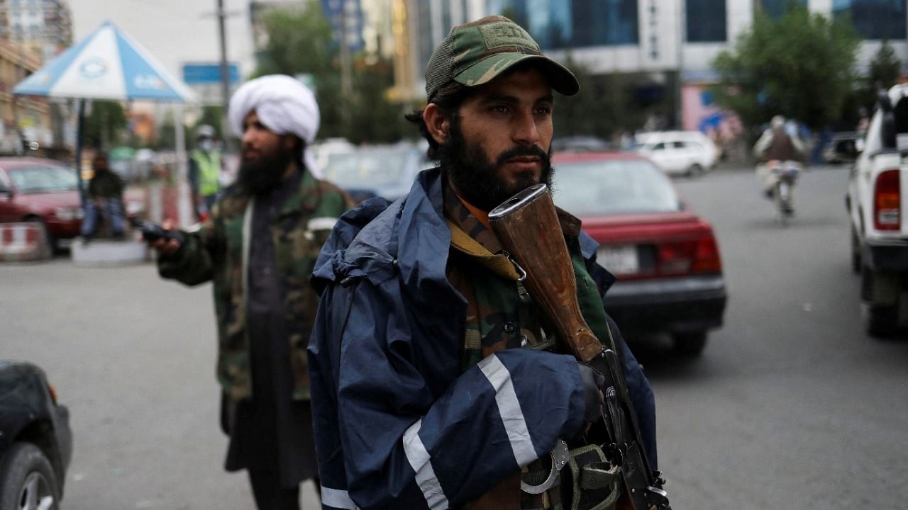 Taliban fighters stand guard at a checkpoint in Kabul, Afghanistan. Credit: Reuters Photo