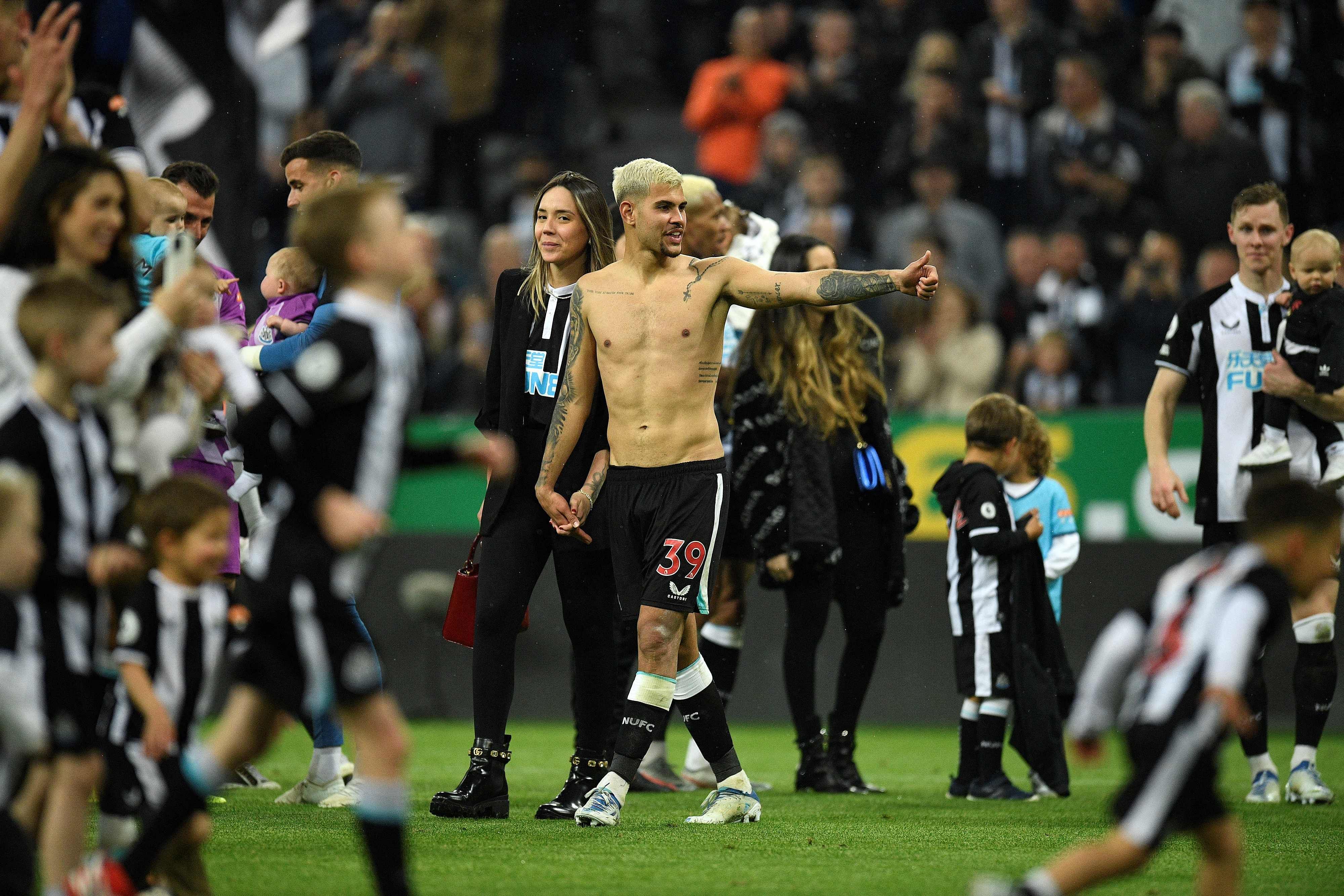 Newcastle United's Brazilian midfielder Bruno Guimaraes and his girlfriend Ana Lidia Martins applauds the fans following the English Premier League football match between Newcastle United. Credit: AFP Photo