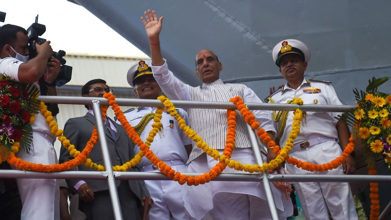 Defence Minister Rajnath Singh (C) waves during the launch ceremony of ‘INS Udaygiri’ warship at a yard of Mazagaon Dock Shipbuilders Limited in Mumbai. Credit: AFP Photo