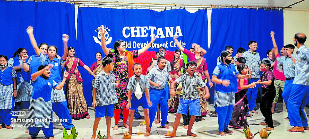 Differently-abled children dance with teachers, during the reopening of the school at Chethana Child Development Centre, in Mangaluru. DH Photo