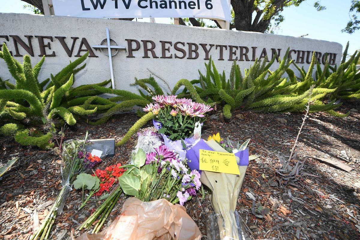 Flowers and notes are seen at a makeshift memorial outside the Geneva Presbyterian Church. Credit: AFP Photo