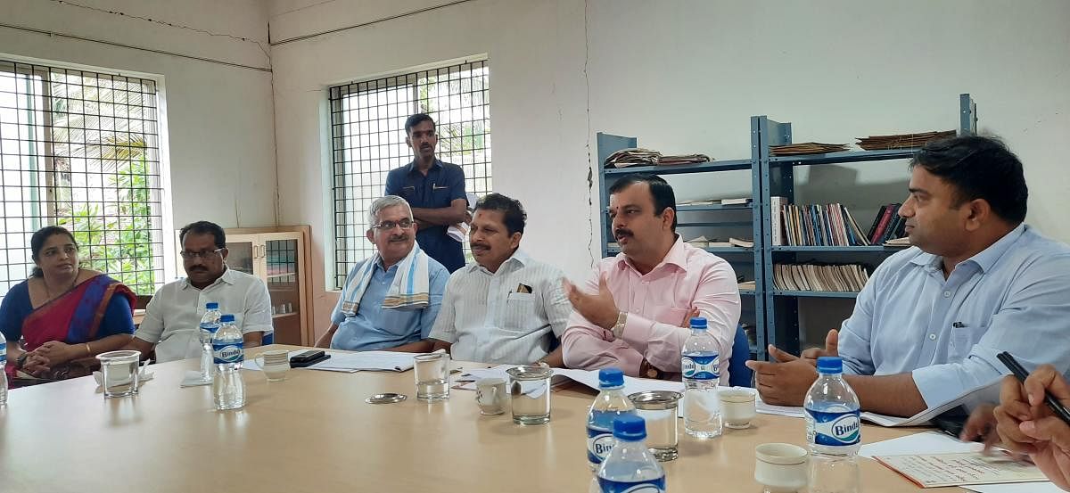 Dakshina Kannada District In-charge Minister V Sunil Kumar speaks at a meeting held at Balavana in Puttur.