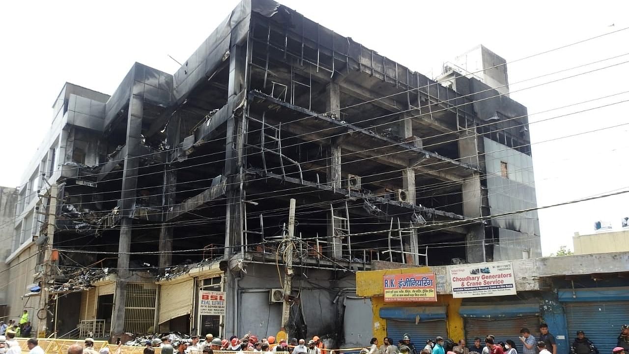 Charred remains of the building after the Mundka fire, in New Delhi. Credit: IANS Photo