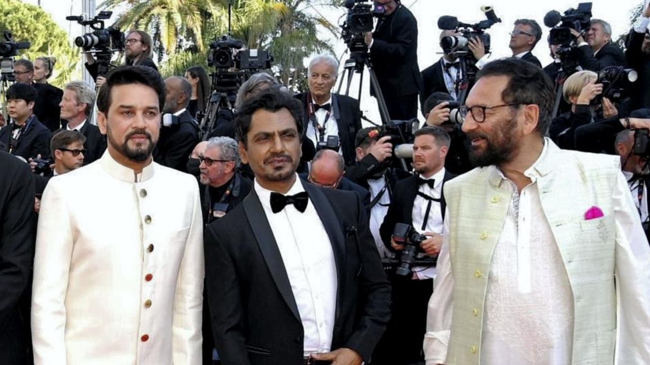 Indian delegation led by Union I&B Minister Anurag Thakur including Bollywood actor Nawazuddin Siddiqui, and filmmaker Shekhar Kapur pose for photographers upon arrival at the opening ceremony and the premiere of the film 'Final Cut' at the Red Carpet of Cannes Film Festival, at Cannes in southern France, Tuesday, May 17, 2022. Credit: PTI Photo