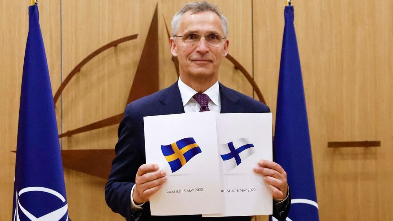NATO Secretary-General Jens Stoltenberg poses during a ceremony to mark Sweden's and Finland's application for membership in Brussels. Credit: AFP Photo