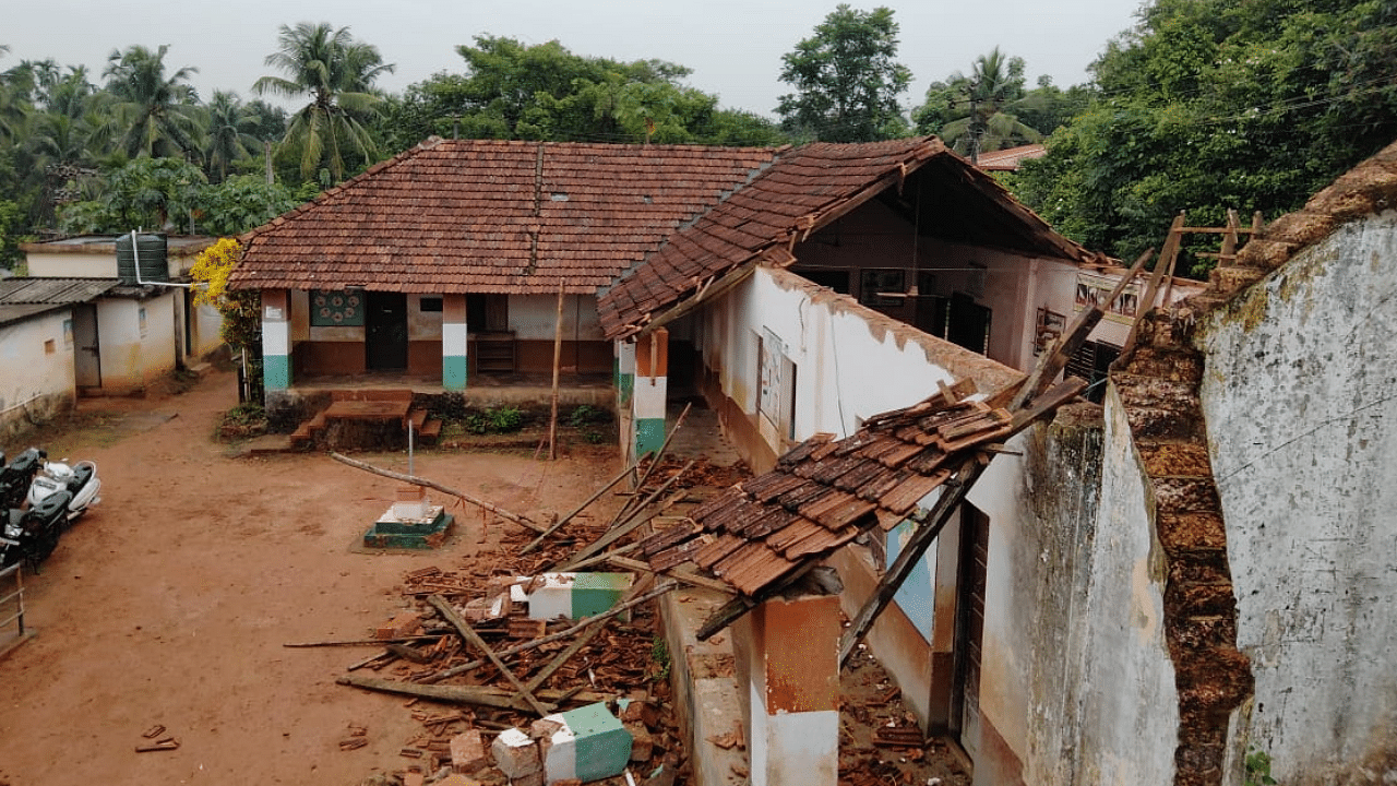   The old school building collapsed following rain at Kinya Belaringe on the outskirts of Mangaluru. Credit: DH Photo