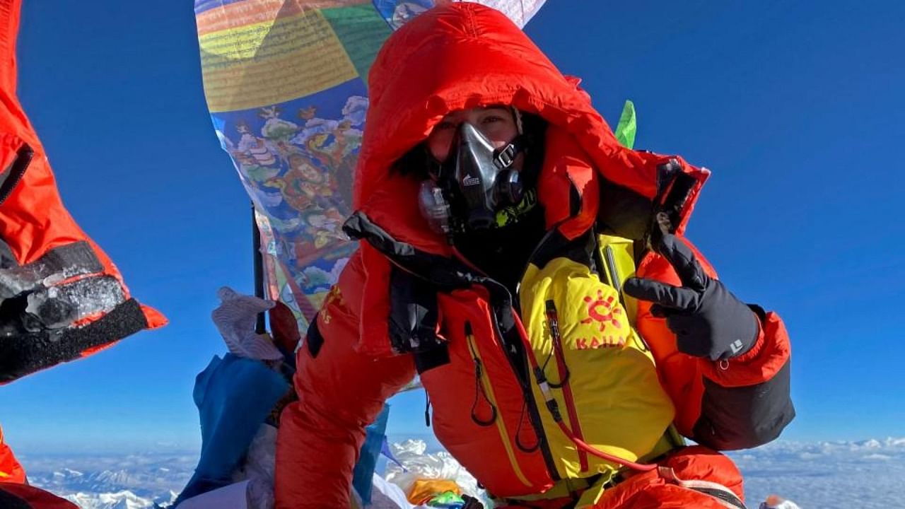 This handout photograph taken on May 12, 2022 and released by the 14 Peaks Expedition shows Ukraine's mountaineer Antonina Samoilova posing at the summit of the Mount Everest in Nepal. Credit: AFP Photo