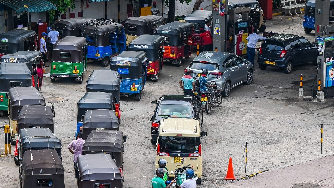 Motorists queue up to buy fuel at a Ceylon Petroleum Corporation fuel station in Colombo. Credit: AFP File Photo