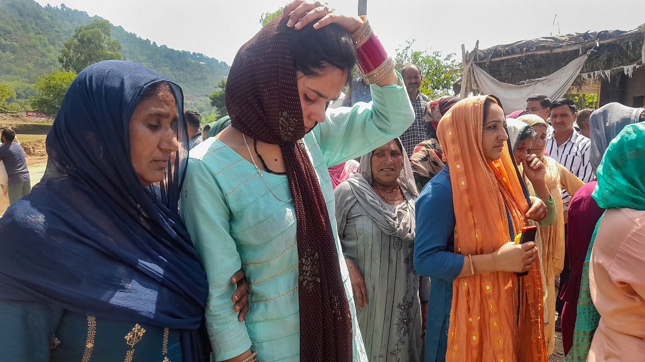 Family members and other villagers during a protest against the killing of Ranjeet Singh in a terror attack, in Baramulla district. Credit: PTI Photo